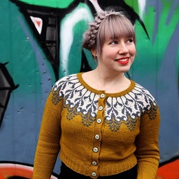 Budding has delicate flower pattern around the yoke